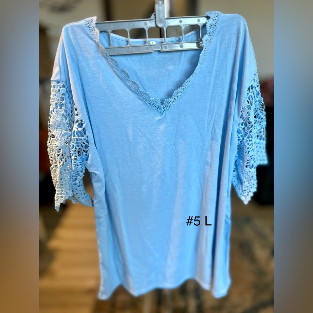 Blue top w lace sleeves. Size L, new but no tags
